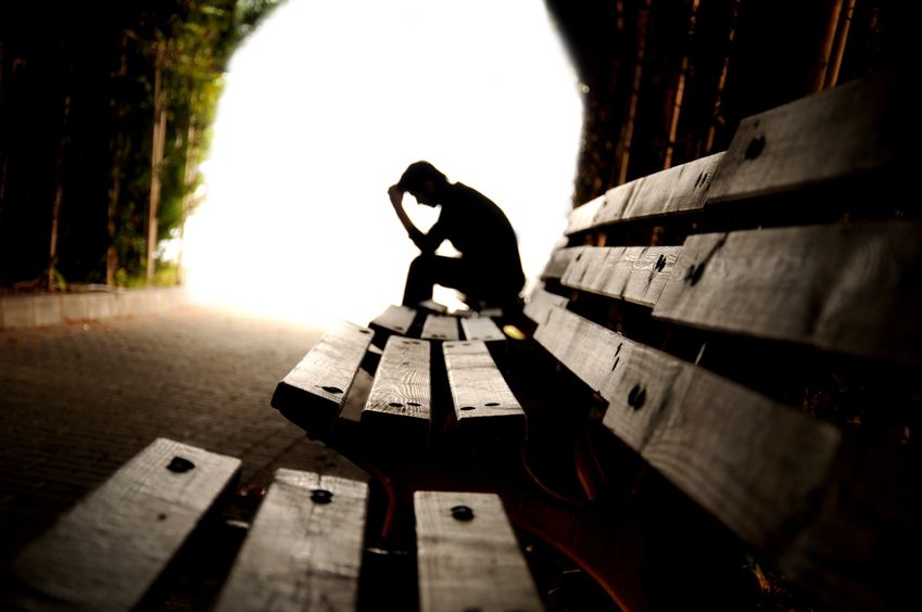 depressed teen silhouette in tunnel