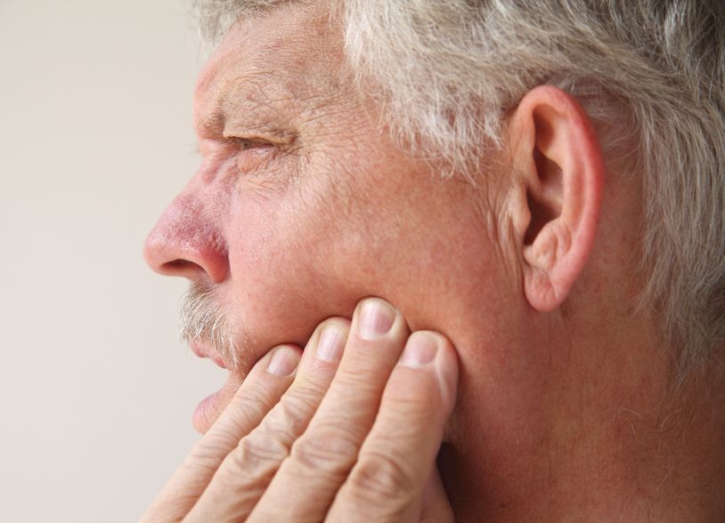 man with pain in his jaw