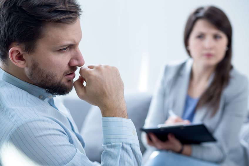 Photo of female psychiatrist diagnosing her male patient