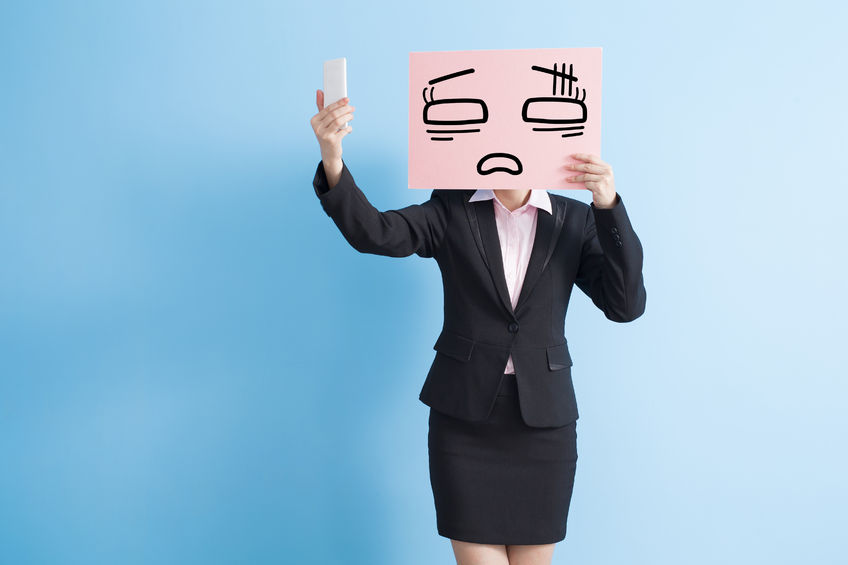 business woman take tired billboard and selfie, isolated blue background