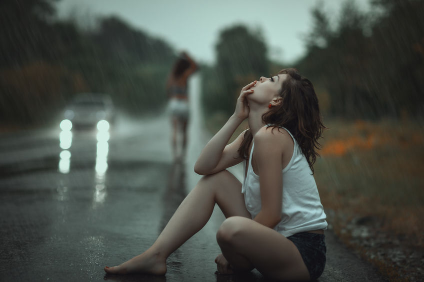 woman in the rain and sad, from saying goodbye